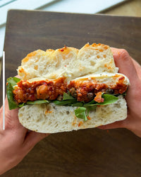 Smashed Nudja Chickpea + Stracciatella Sandwich with Crispy Capers